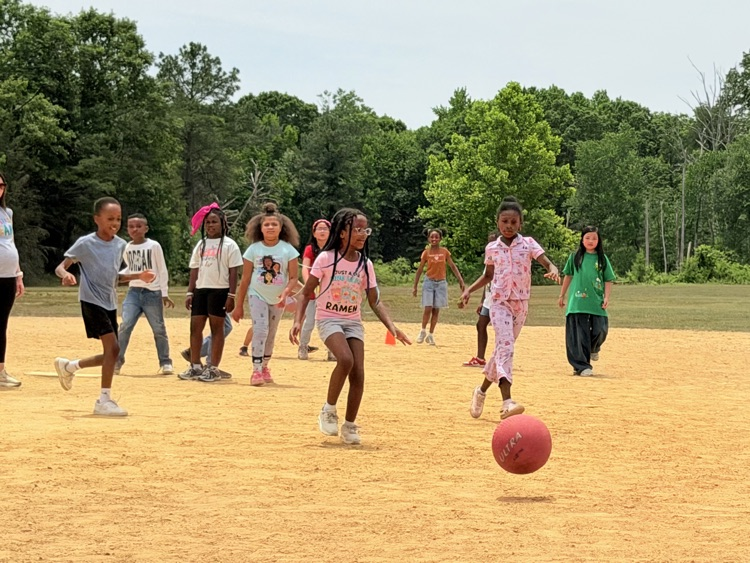 child playing kickball