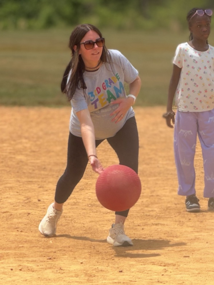child playing kickball