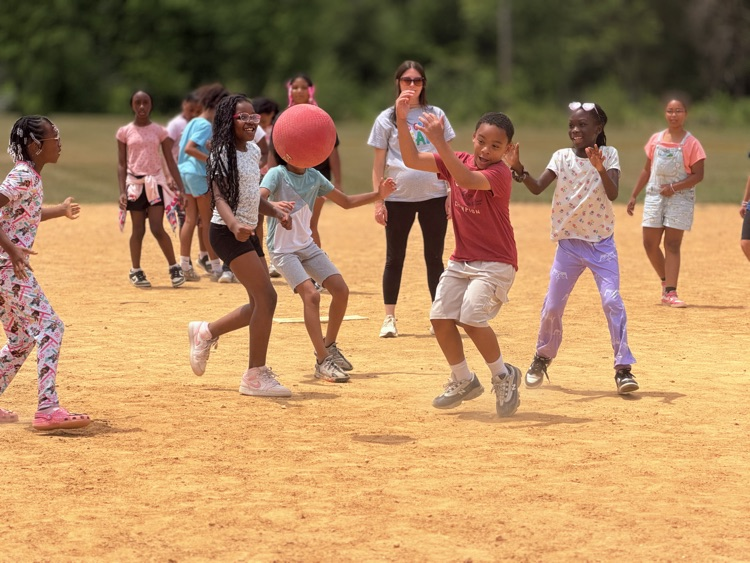 child playing kickball