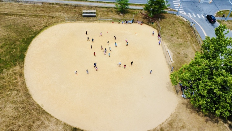 child playing kickball