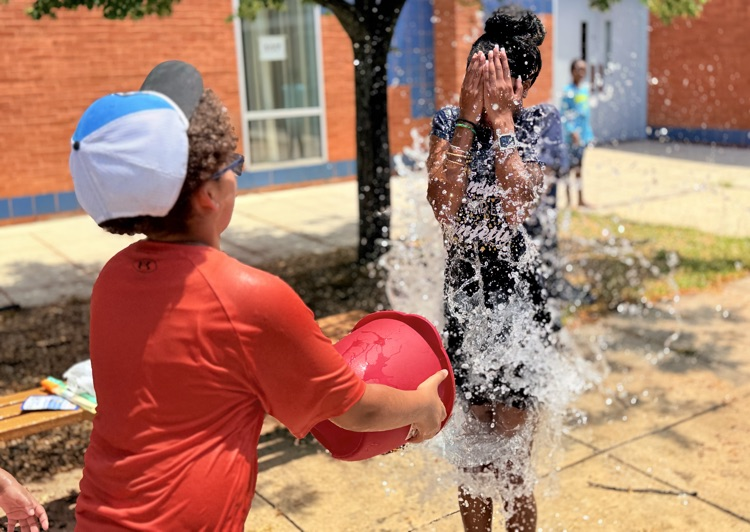 teacher getting water thrown on her