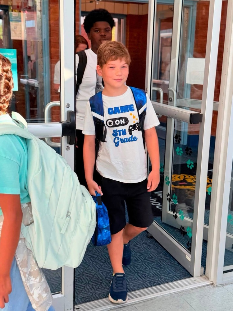 student walking in the door