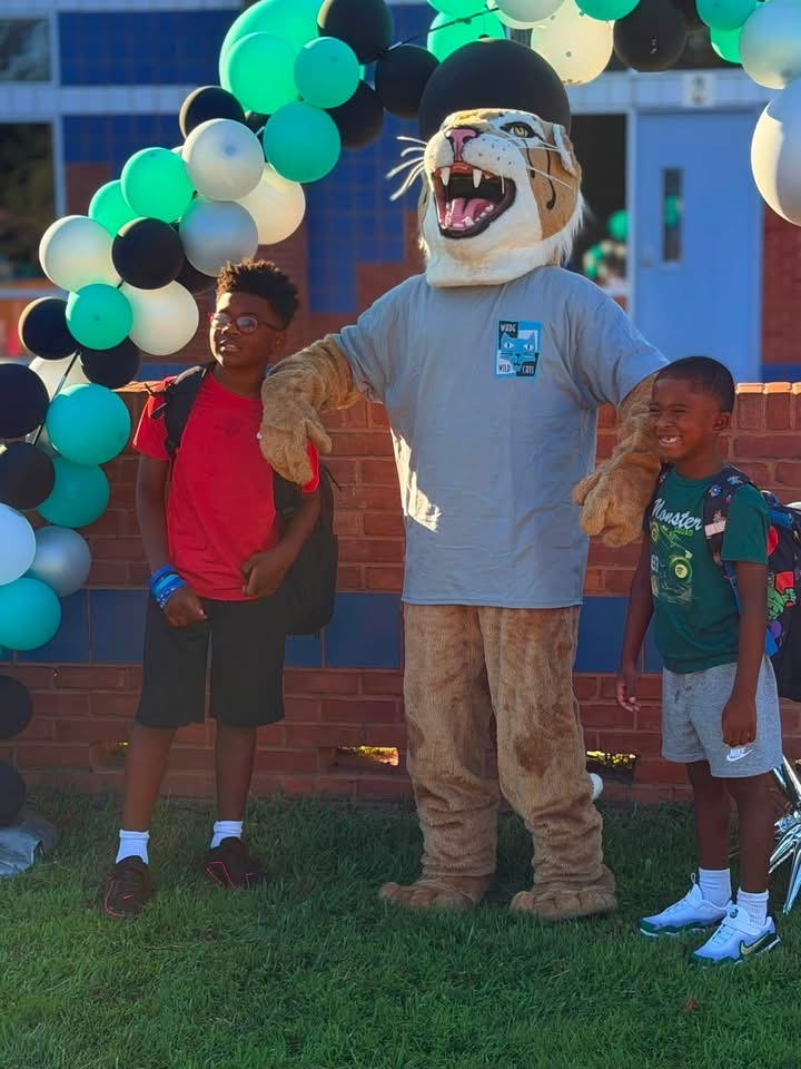 mascot with students