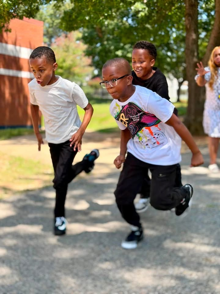 group of boys running at recess 