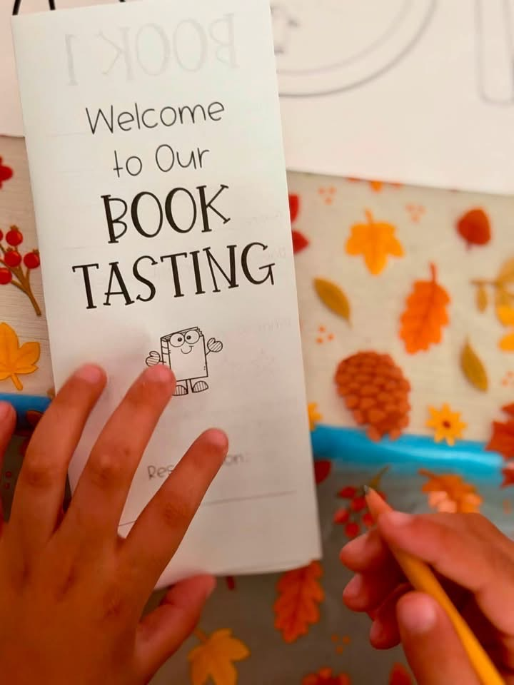 hands on a paper that says book tasting 