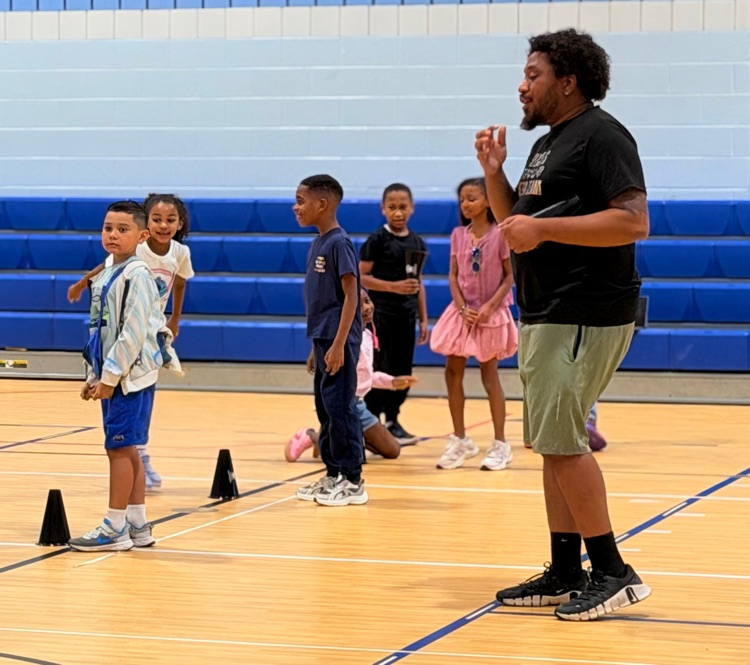 teacher telling students the rules of the game. 