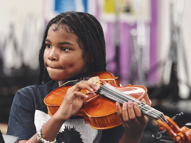 student playing instrument 