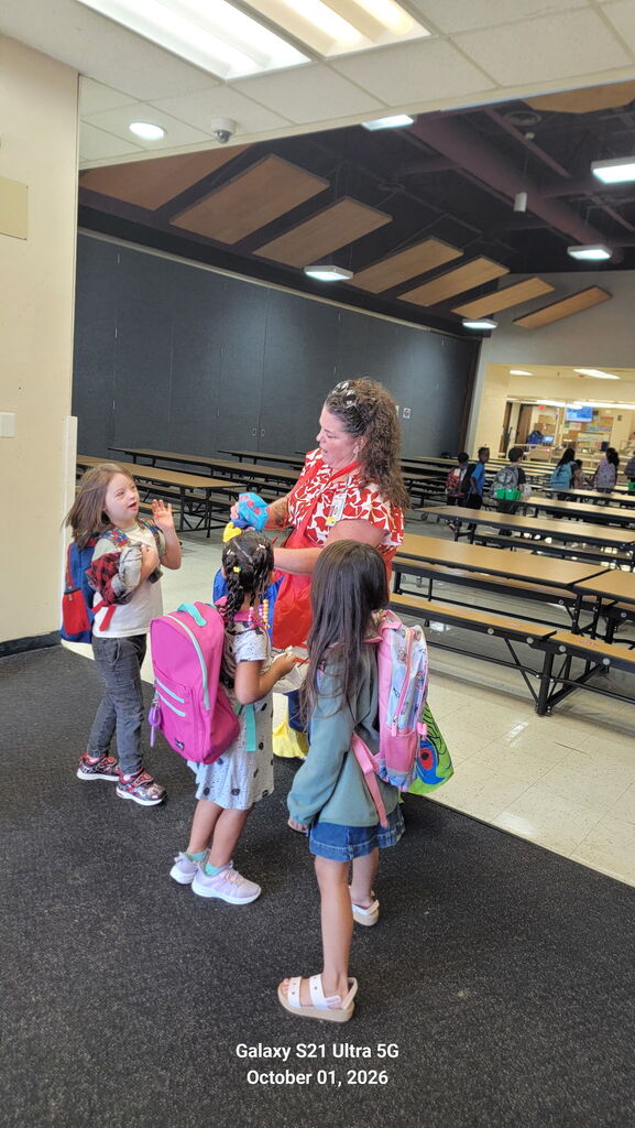 Ms. Blandford Greeting Students for the October 1 Attendance kickoff.