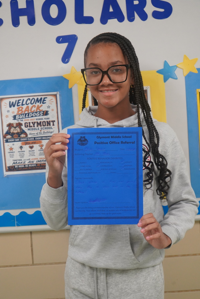 Student holding Positive Office Referral