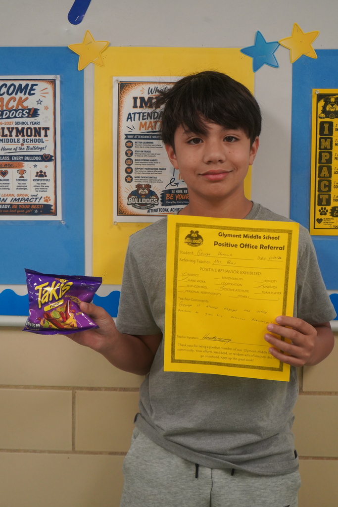 Student holding Positive Office Referral
