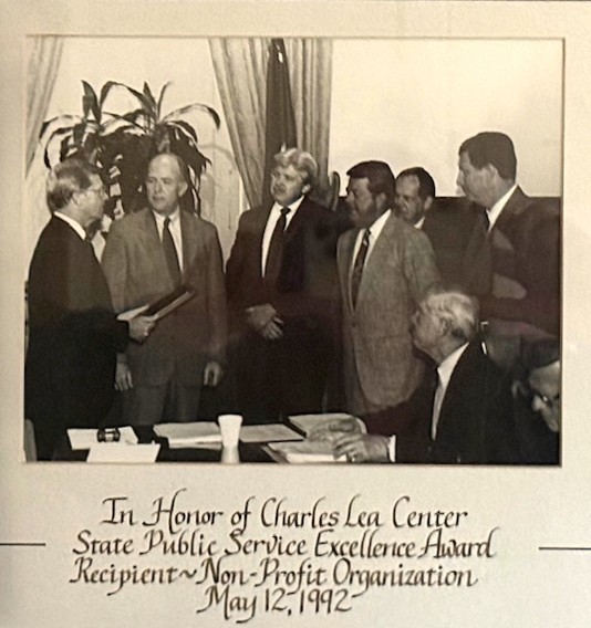 Picture of men with an award