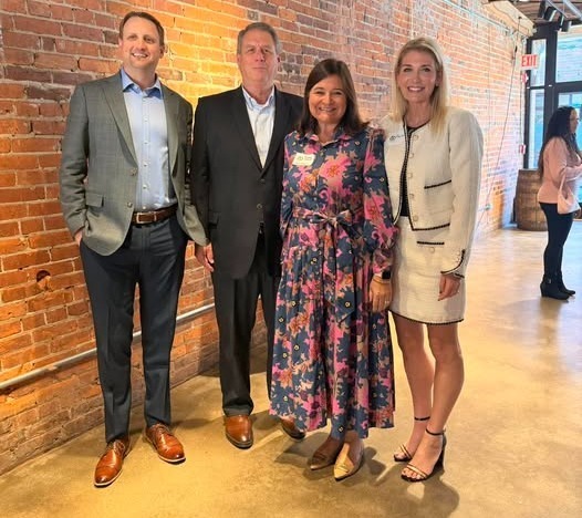 Four people with awards