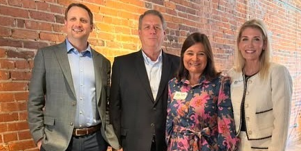 Four people with awards