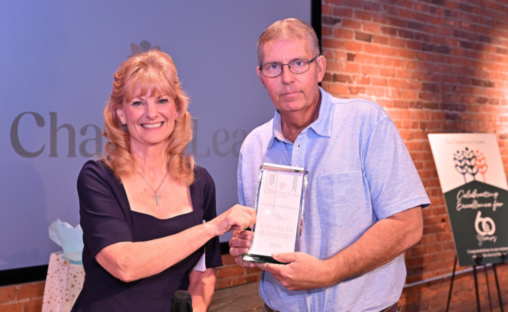 man and woman and award