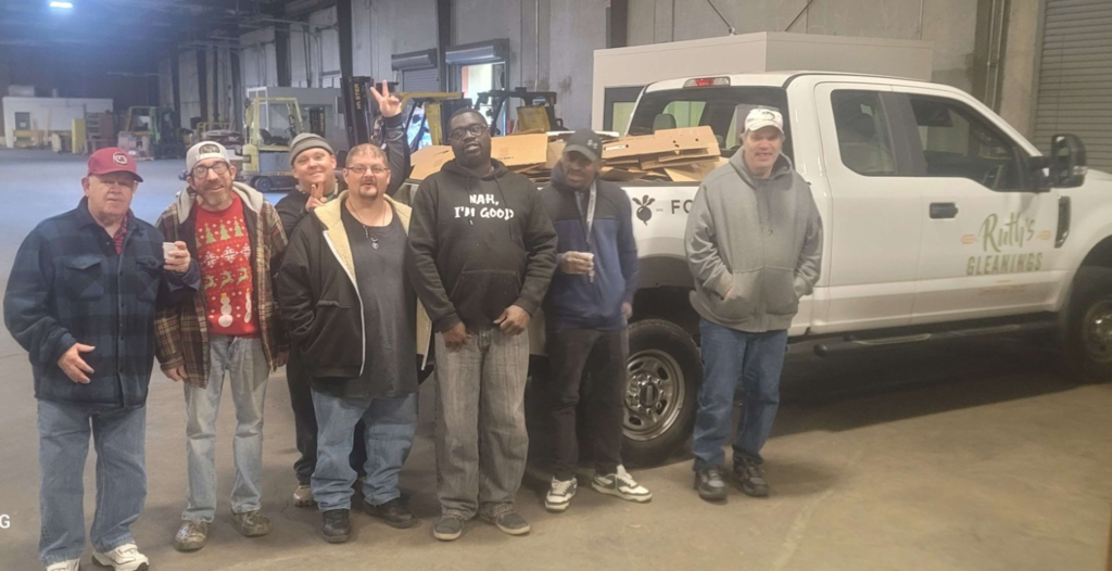 men in front of a truck