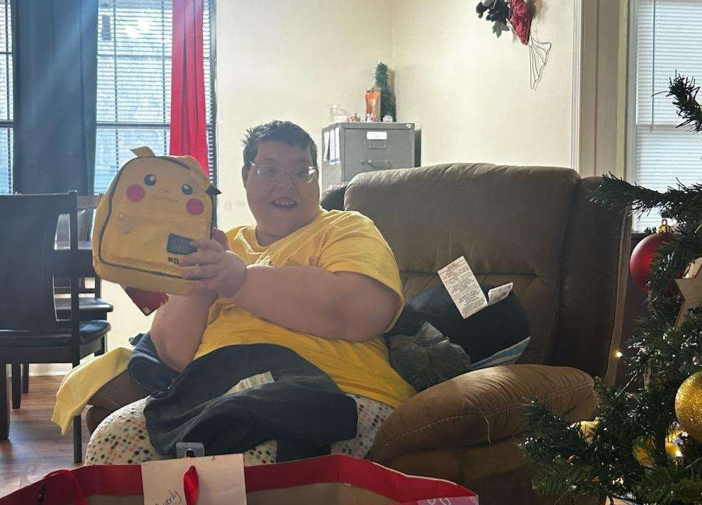 lady smiling and holding gift