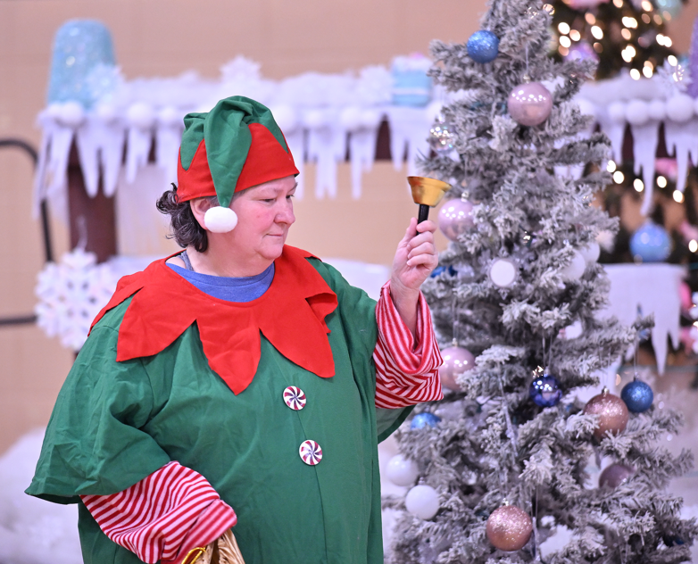 santa;s elf ringing a bell