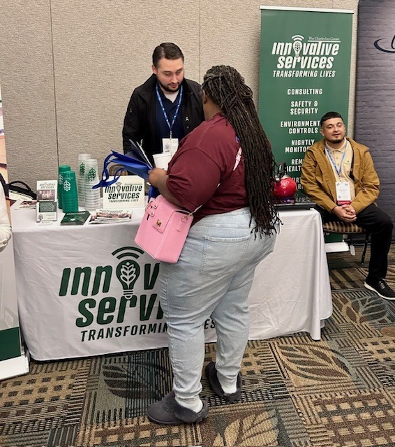 three peoplee at conference