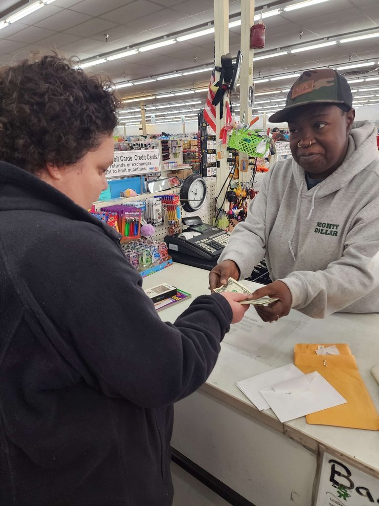 a woman buying items