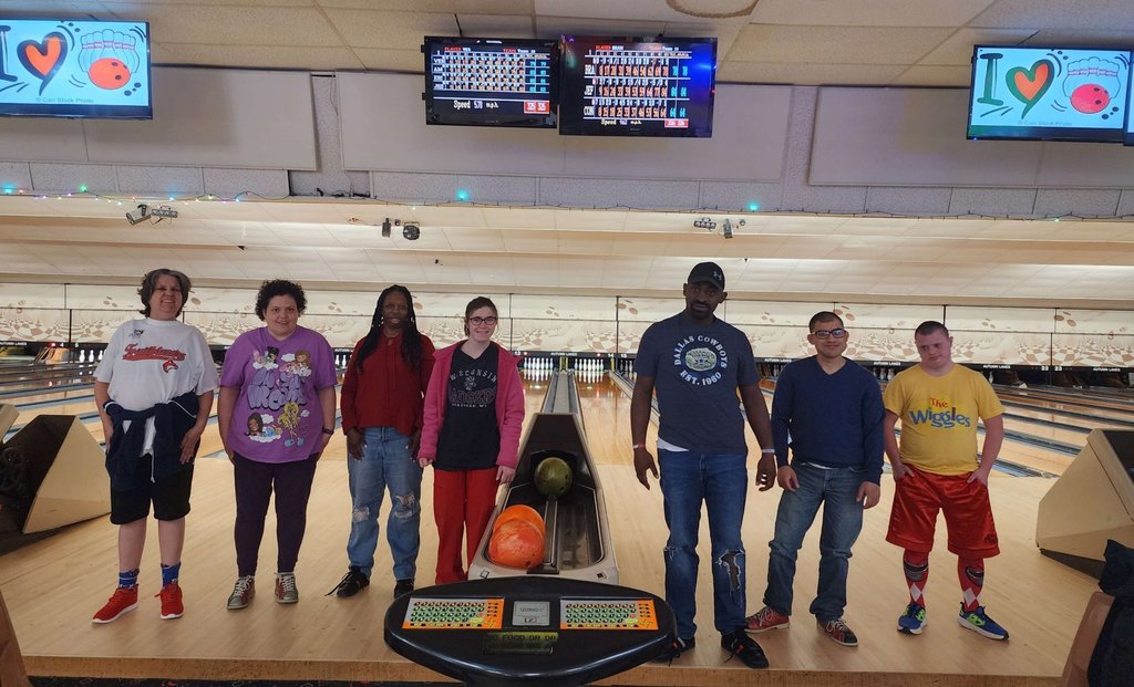 Group of men and women bowling