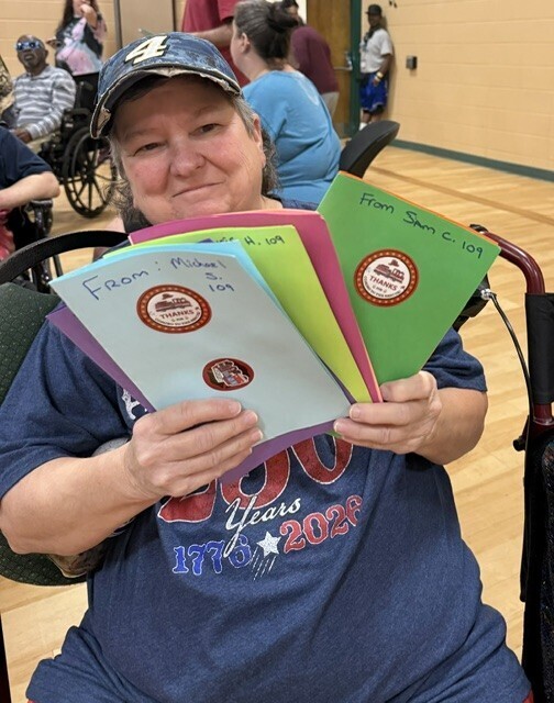 Jenny holding cards