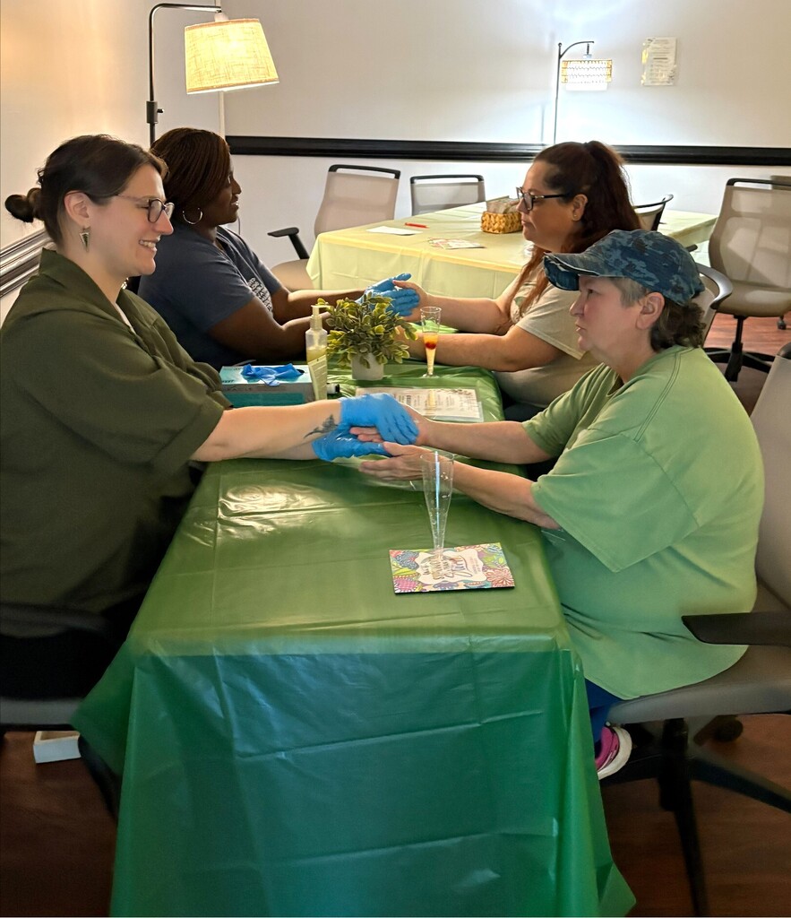 women getting hand massage