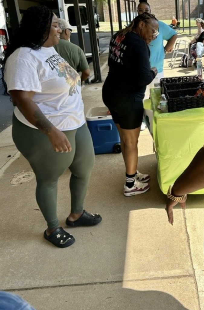 2 ladies outside with snackes