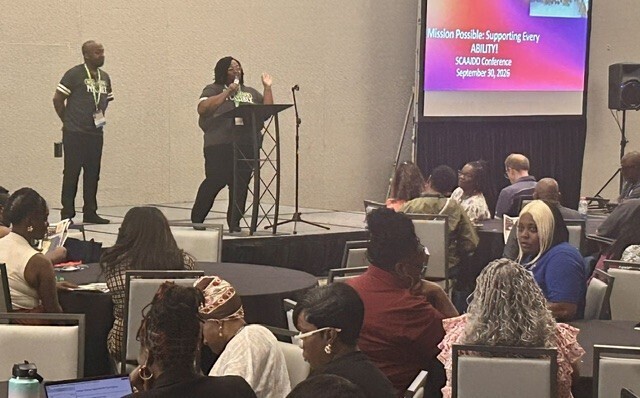 People presenting at a conference