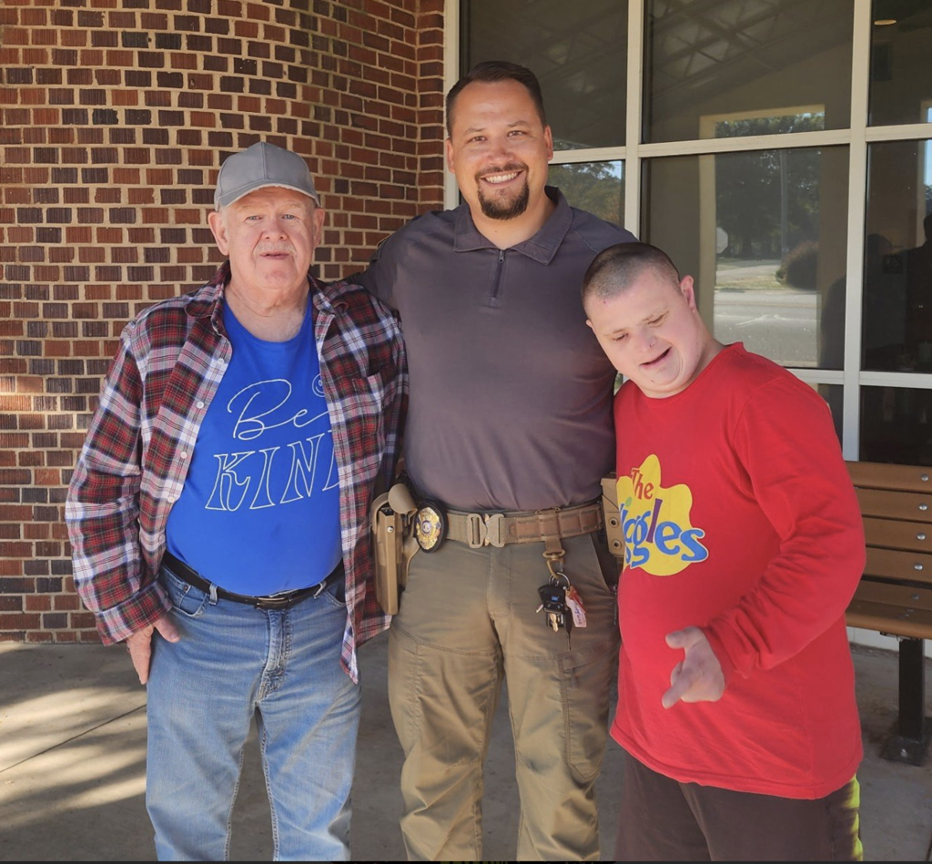 policeman and 2 guys