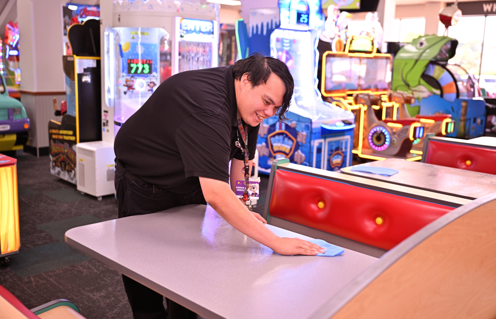 Man wiping table