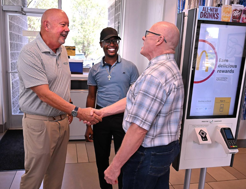 Men talking and shaking hands