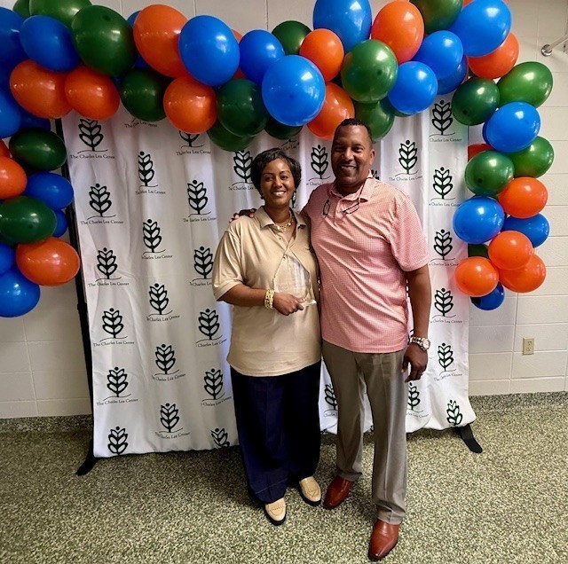 Two people and an award