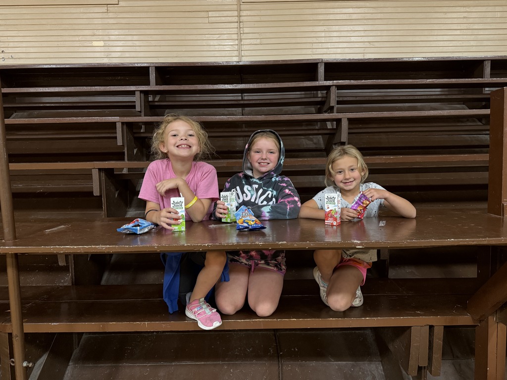 2nd graders enjoying crackers & juice