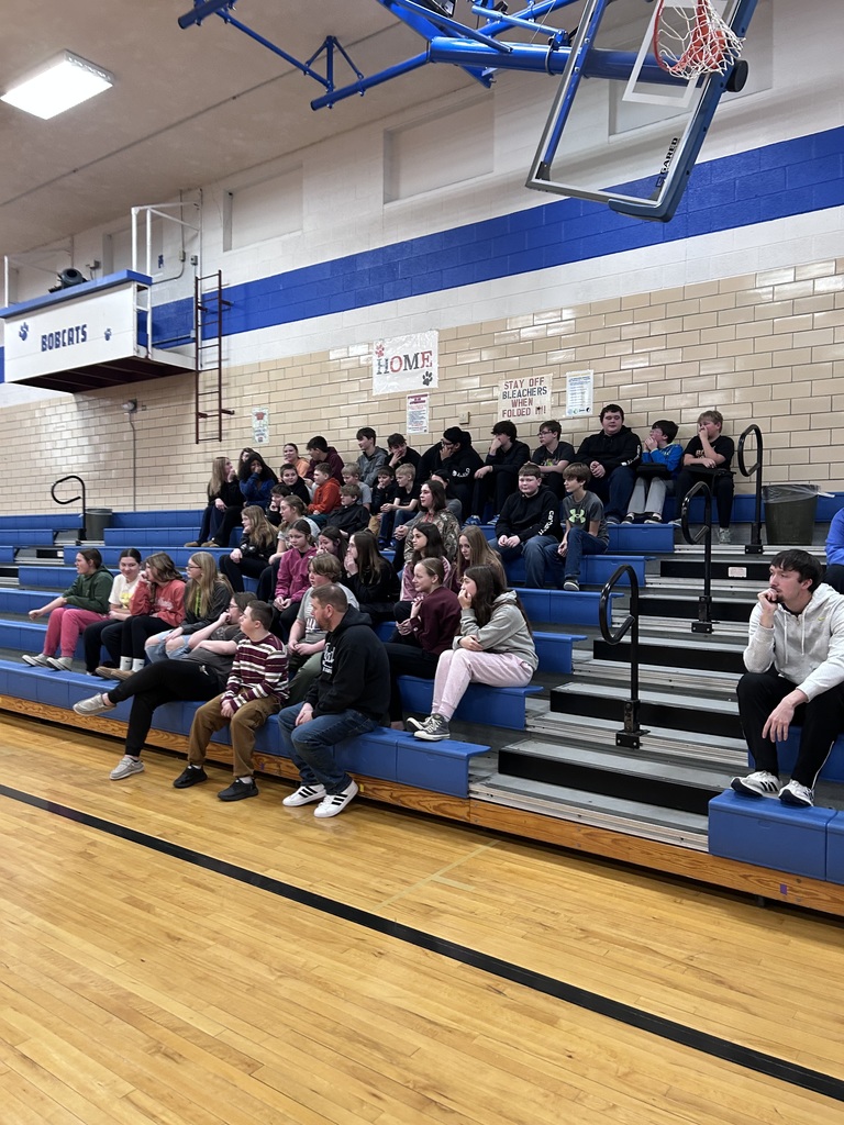 Students listening to the speaker.