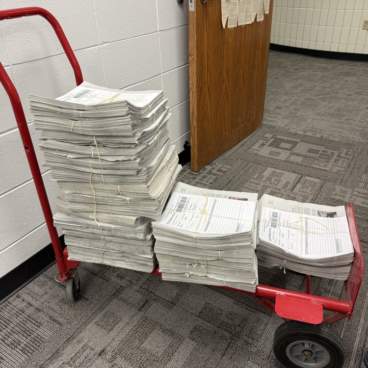 Bundled Newspapers on a Cart
