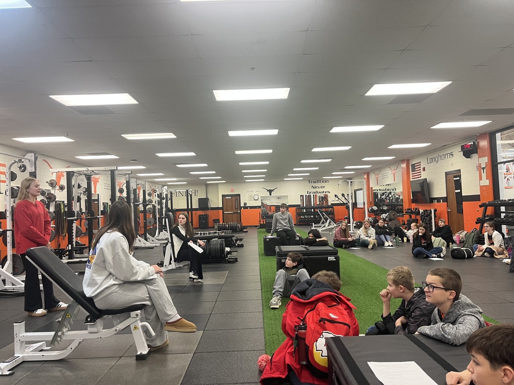 Ave speaking with FBLA members during monthly meeting