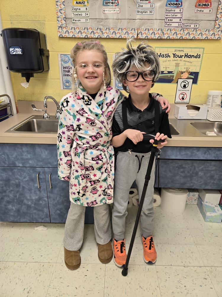 two children dressed as old people