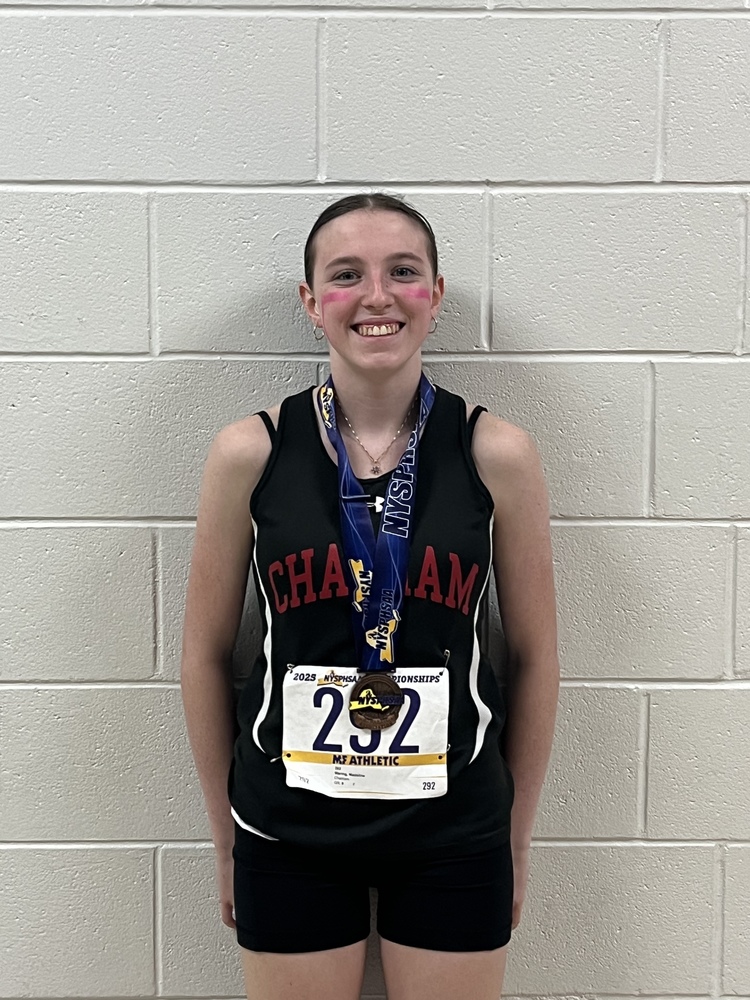 Teenage girl in running outfit wearing medal