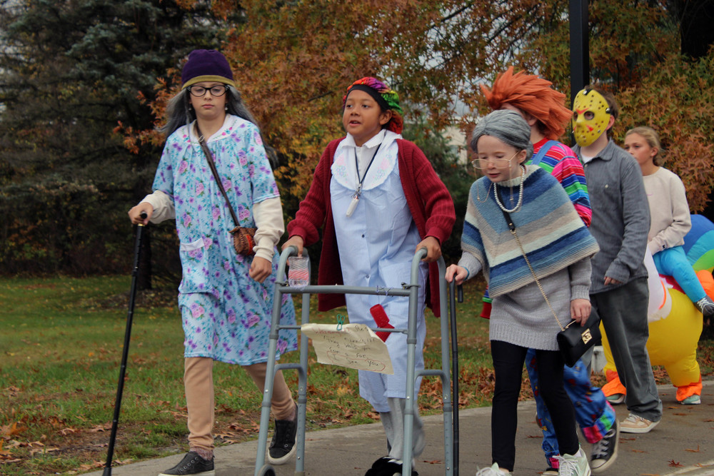 three girls dressed up as old women