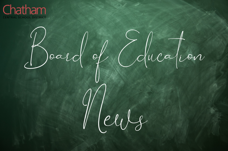 Chalkboard with Board of Education News written on it