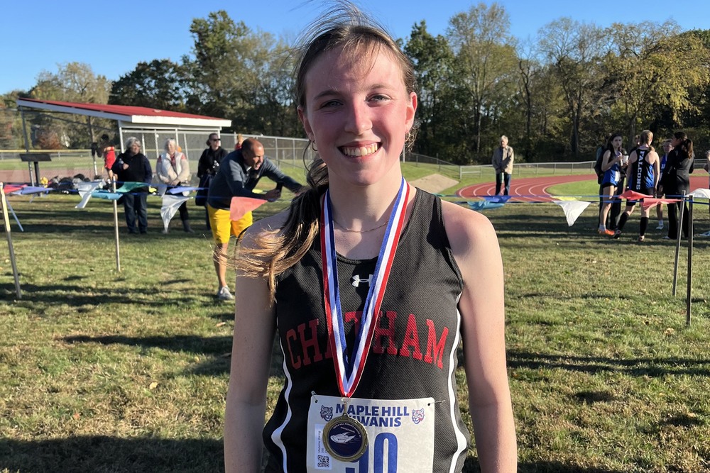 Girl Smiling wearing medal