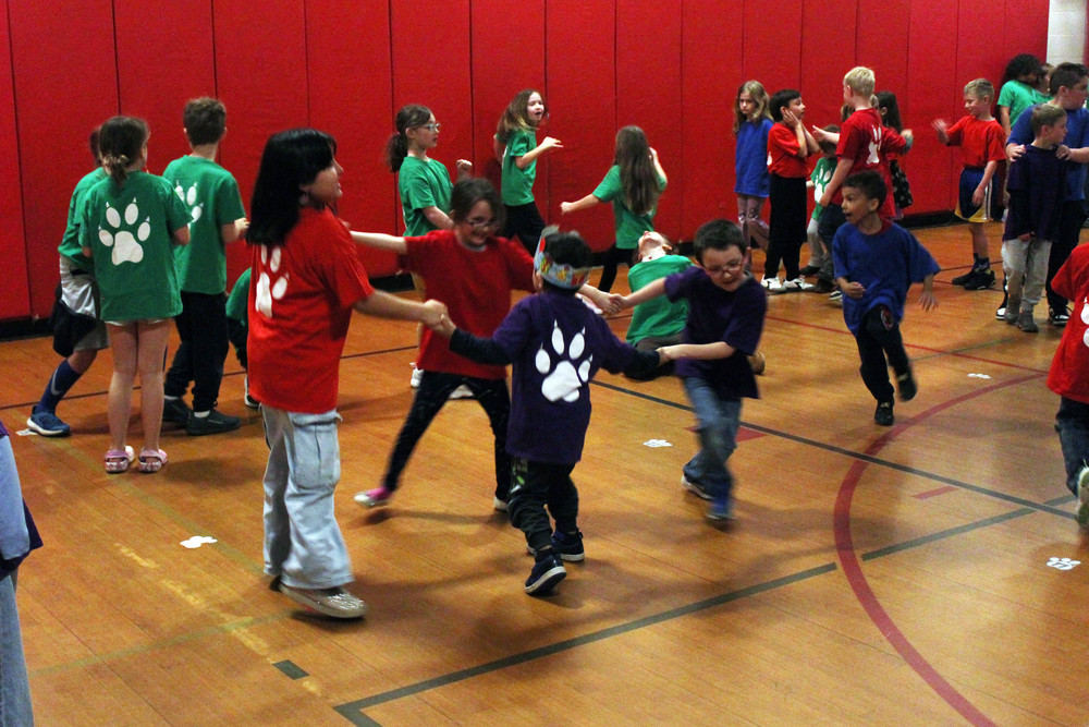 student dancing in gym