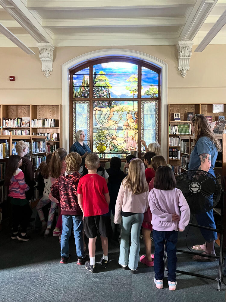 students listening to librarian 