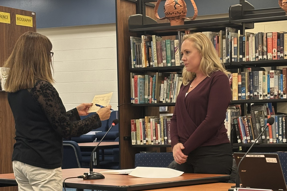 Ashley Zwingelberg being swore in by Board Clerk