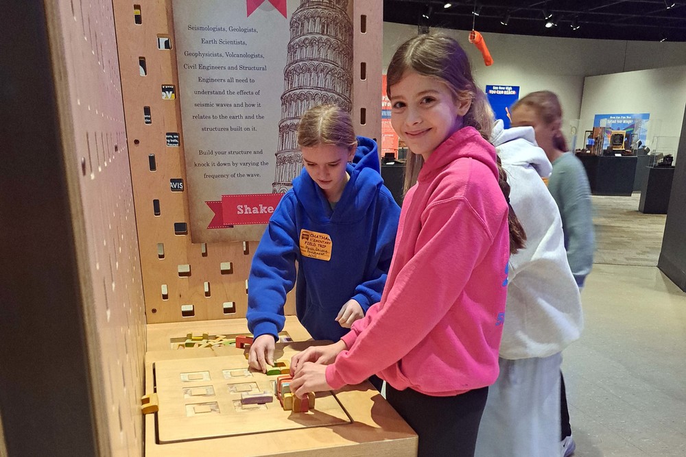 girl at MiSci Museum exhibit