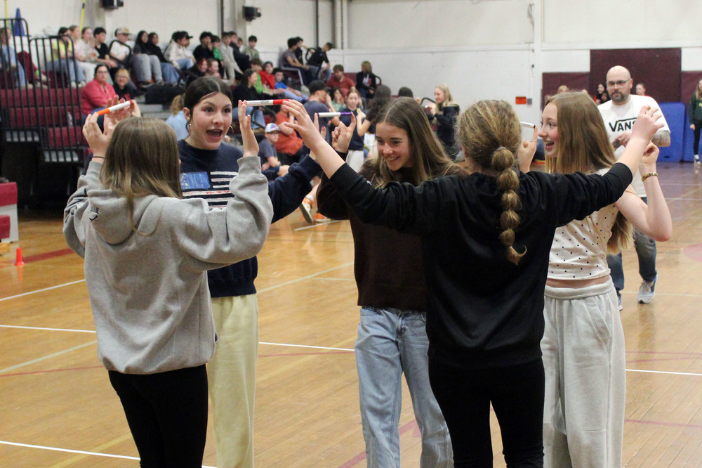 group of girl making circle by holding markers