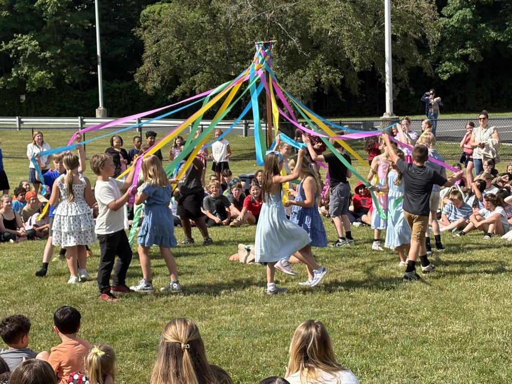 fourth grade students doing maypole dance