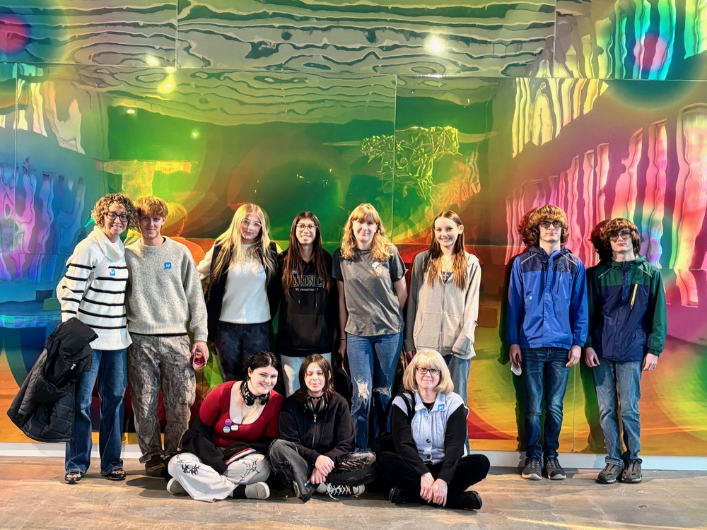 Media Arts class poses in front of art installation