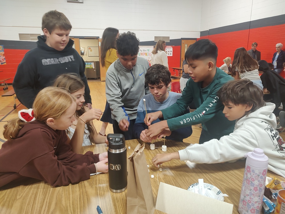 students building spaghetti towers