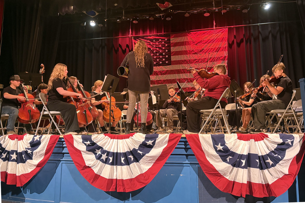 CMS orchestra playing on stage